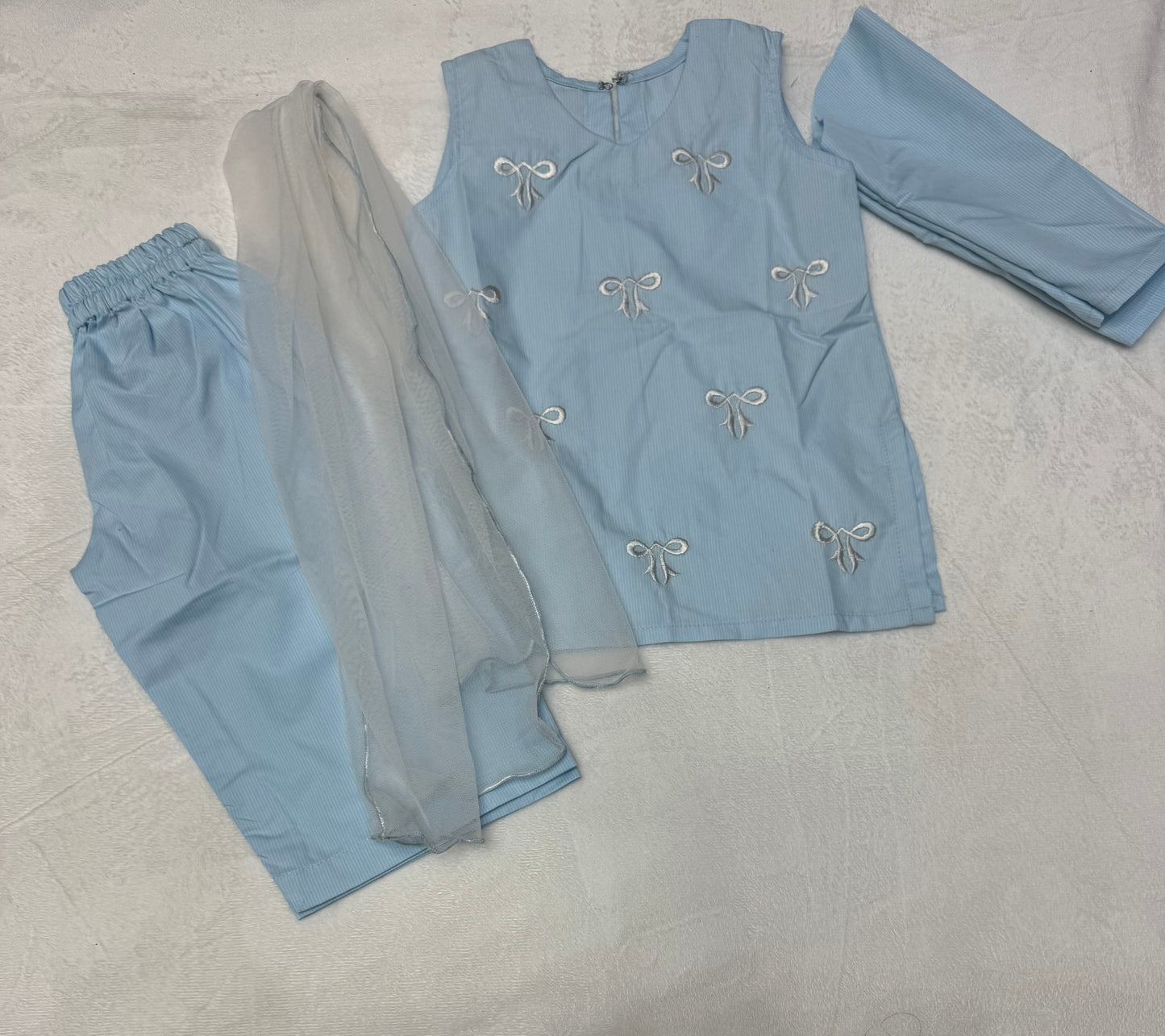 Close-up of embroidered bow detailing on Sky Blue Baby Girl Kurta Set With Dupatta - Pakistani baby clothes UK