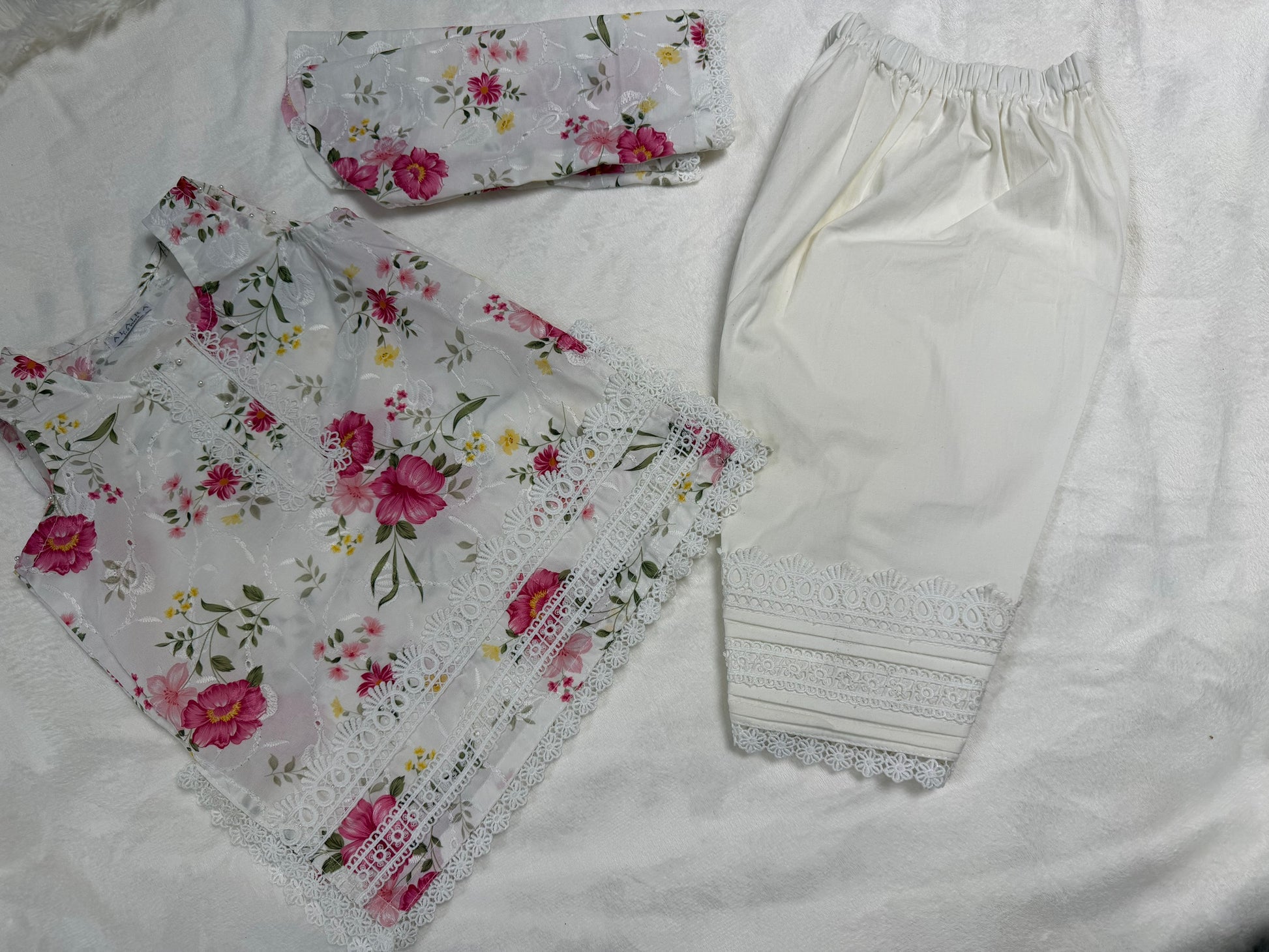 Close-up of intricate floral embroidery on White Floral Baby Girl Kurta Set - Pakistani baby clothes UK
