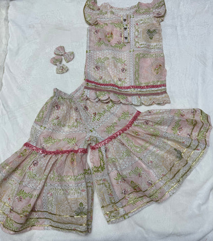 Close-up of traditional print and flared gharara trousers on Blush Pink Baby Girl Gharara Set - Pakistani baby clothes UK
